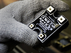 Selecting a solid-state or electromechanical relay for an application